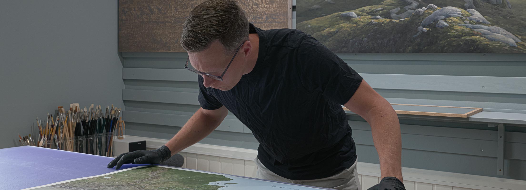 Rinus inspecting a Beleriand map print in his studio