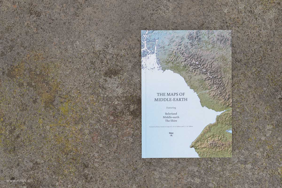 The Maps of Middle-earth hardcover book photographed closed on a rock surface